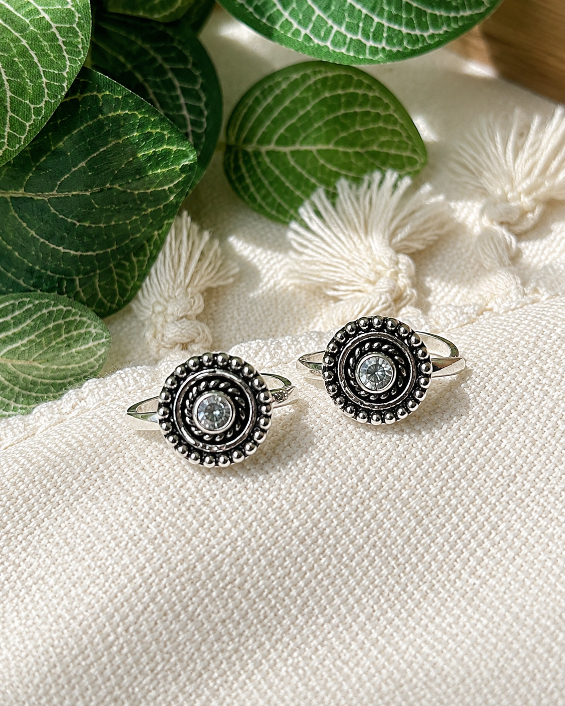 925 silver oxidized beaded halo toe ring pair with white stone on tassel fabric